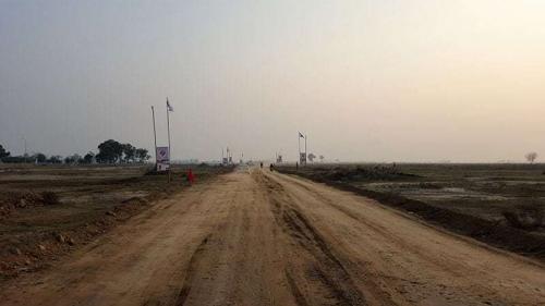 Road towards DHA Phase 9 Prism from D Block 9 Town